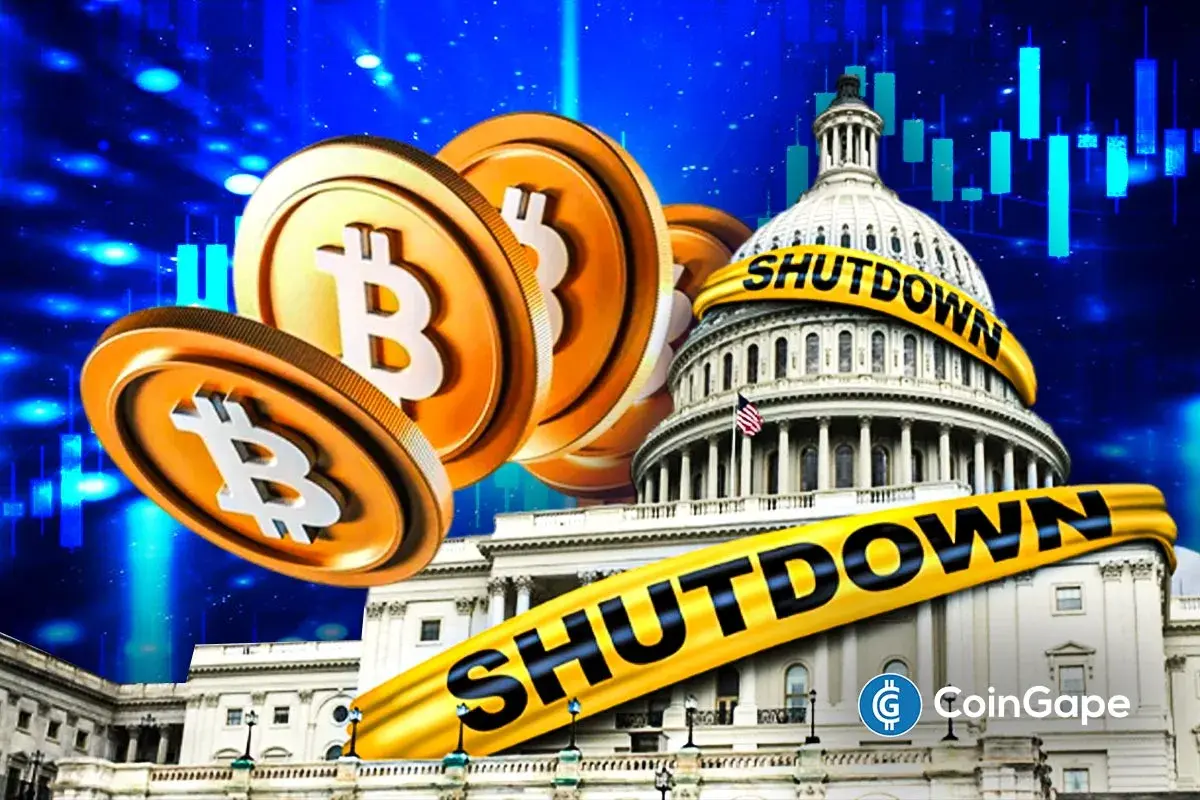Bitcoin coins in front of U.S. Capitol building wrapped with shutdown tape, showing crypto decline amid government shutdown.